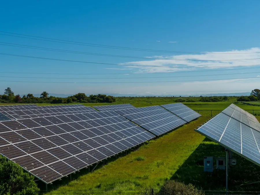 Solar panels in a rural countryside field, illustrative photograph